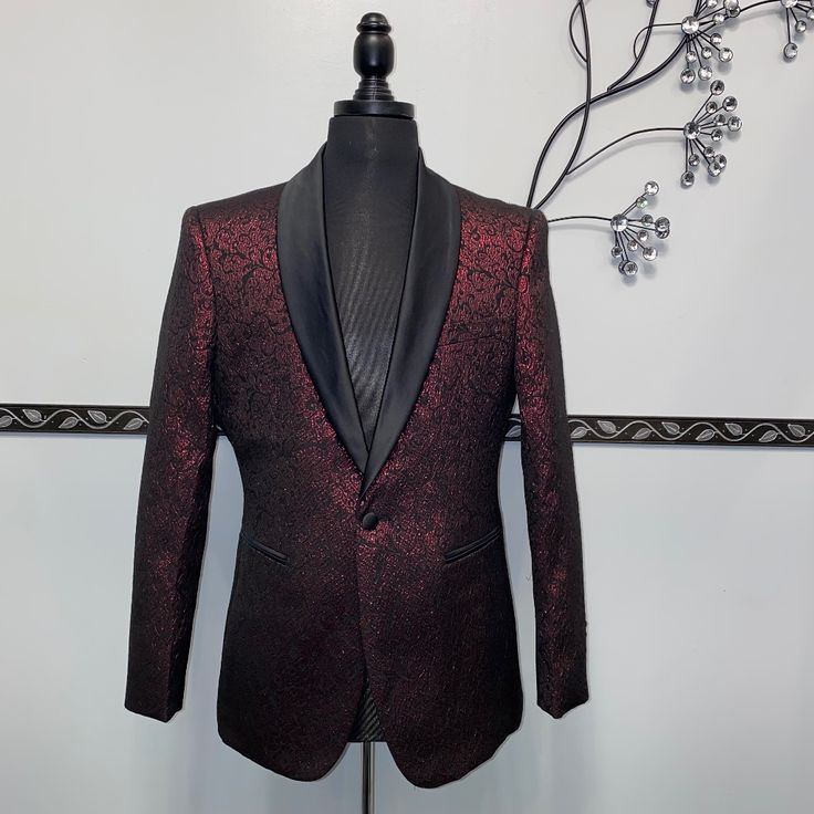 This Blazer Features A Beautiful Metallic Floral Pattern, 100% Polyester Fabric, With Front Button Closure. Red Festive Semi-formal Blazer, Luxury Burgundy Blazer For Formal Occasions, Elegant Red Fitted Tuxedo, Red Tuxedo Blazer For Party, Luxury Burgundy Suit For Formal Occasions, Luxury Red Blazer For Parties, Formal Burgundy Tuxedo, Elegant Burgundy Blazer For Party, Luxury Red Party Suits