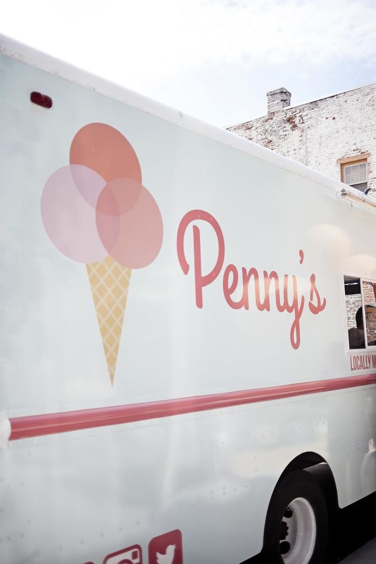 an ice cream truck is parked in front of a brick building with the word penny's written on it