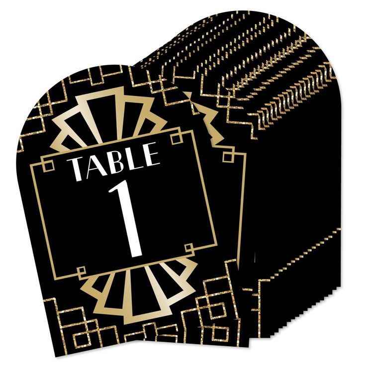 a black and gold table number card with an art deco design in the shape of a heart