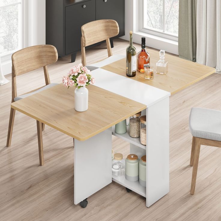 a kitchen table with two chairs next to it and an open shelf on the other side