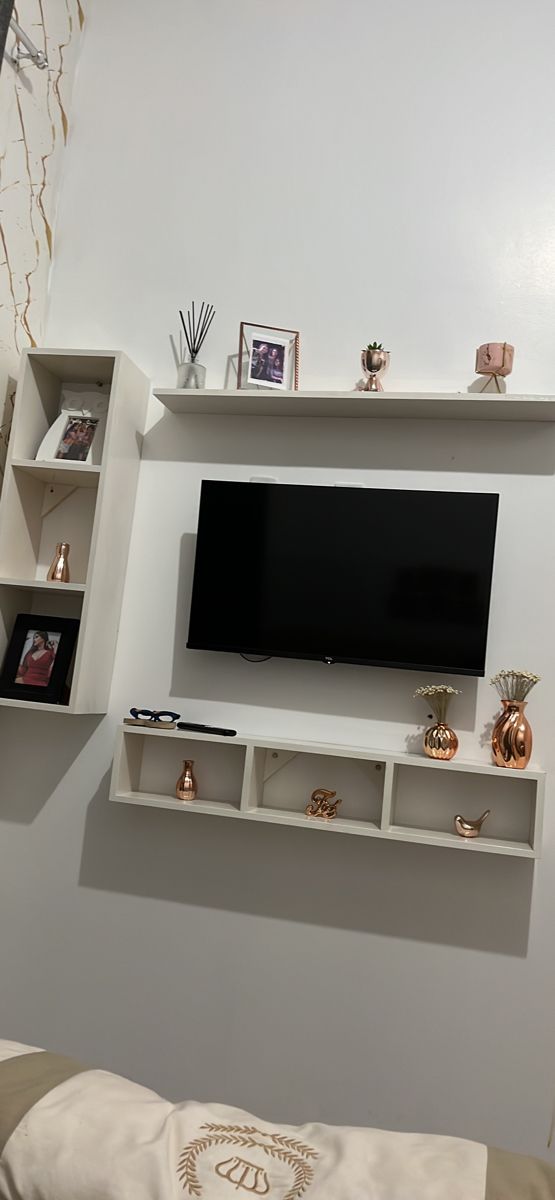 a flat screen tv mounted to the side of a wall