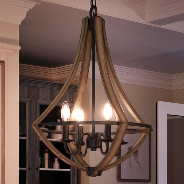 a chandelier hanging from the ceiling in a kitchen