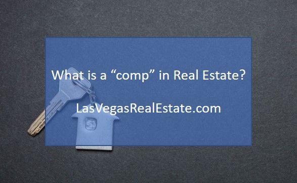 a house shaped keychain with the words what is a'comp'in real estate?