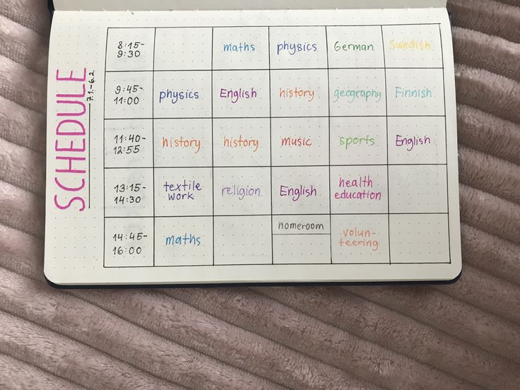 a planner with the words schedule written in different colors and sizes on top of it