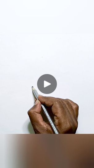 a person writing on a piece of paper with a pen