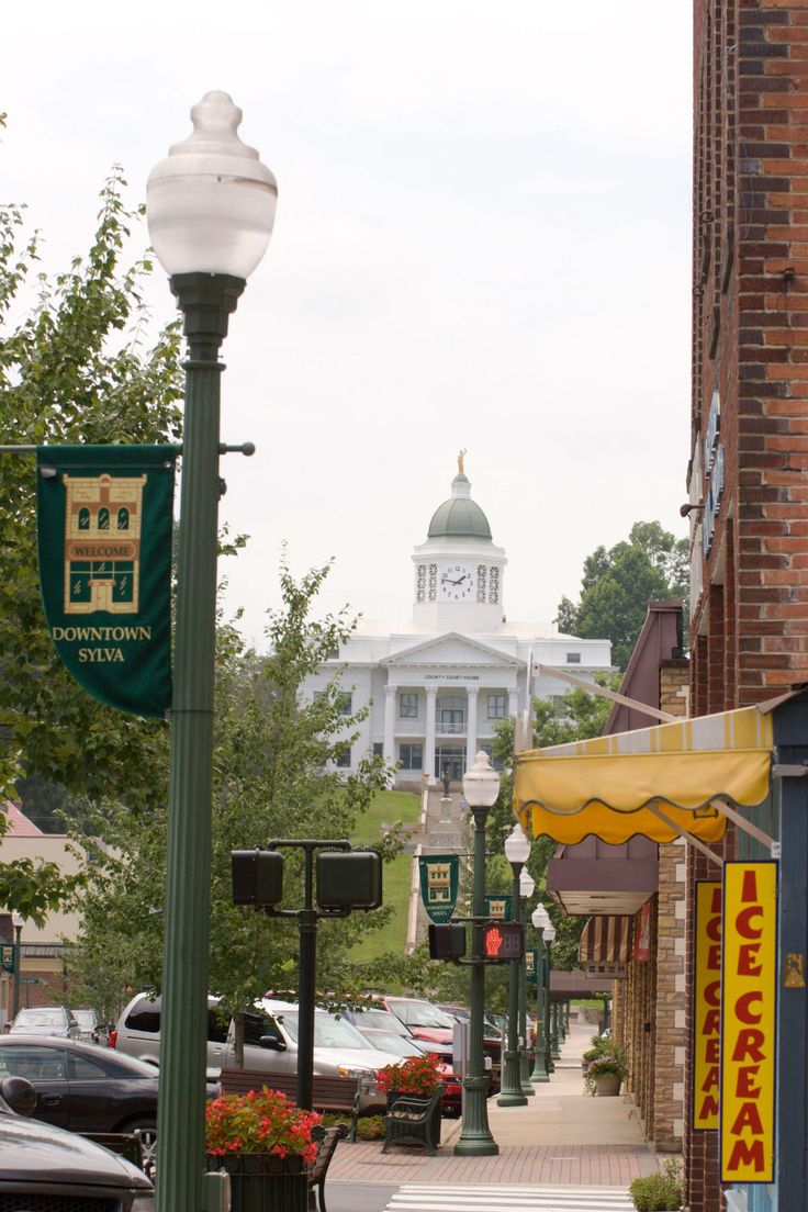 a city street with cars parked on both sides