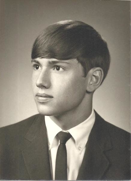 black and white photograph of a young man in a suit