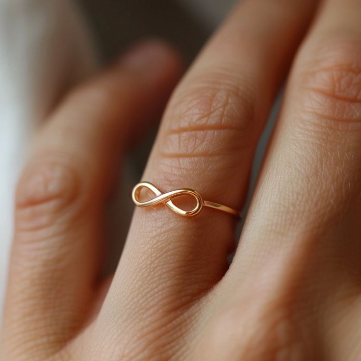 14k Gold Plain Infinity Ring, Infinity Symbol Gemstone Ring, Unique Gold Infinity Ring, Infinity Love Band Ring, Gold Iconic Infinity Ring 🌺Item Detail🌺 ♠️ Item Name : Infinity Ring ♠️ Metal : 925 Silver  ♠️ Size : Select the Variations                                                                           🌊 *About Us: Natural World Jewelry* 🐚 At Natural World Jewelry, we're passionate about bringing the serene beauty of the ocean to your everyday life. Our artisanal jewelry pieces are lo Modern Twist Infinity Stackable Rings As Gift, Adjustable Infinity Promise Ring, Adjustable Infinity Stackable Rings For Anniversary, Adjustable Infinity Stackable Anniversary Rings, Personalized Adjustable Infinity Rings, Adjustable Infinity Stackable Rings Gift, Hypoallergenic Infinity Promise Ring, Adjustable Infinity Stackable Rings With A Modern Twist, Adjustable Infinity Stackable Rings