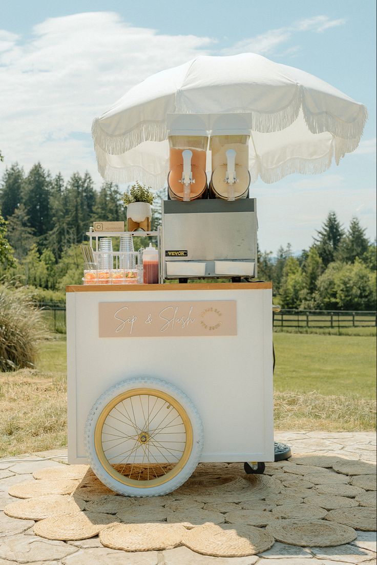 an ice cream cart with some food on it