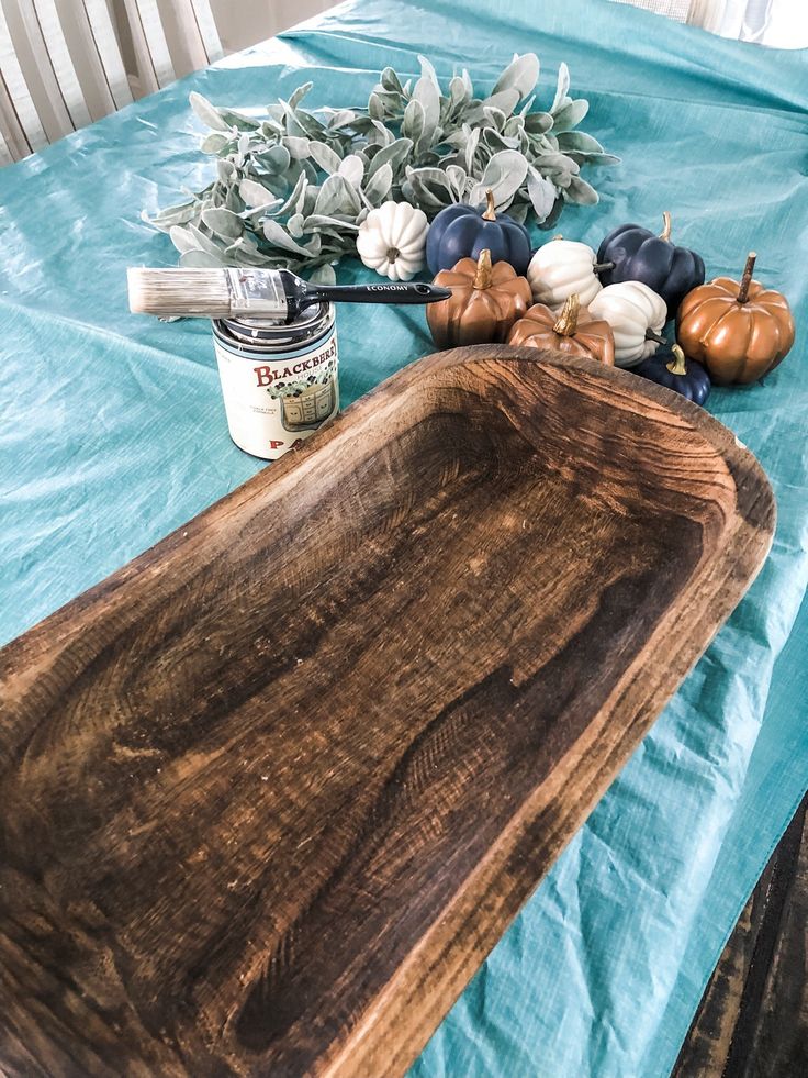 a wooden cutting board sitting on top of a table