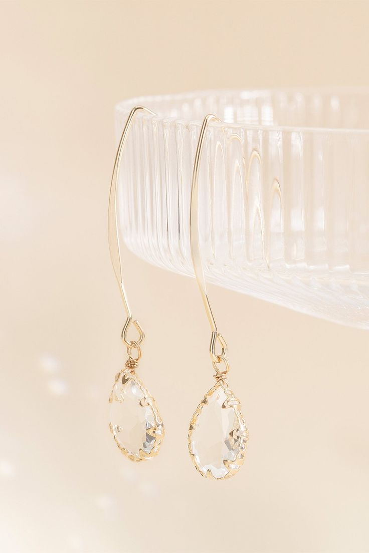 These glass teardrop hook earrings are the perfect addition to your bahcelorette going-out look. Shop our jewelry collection today. Make an entrance anywhere with these fun, dangly hook earrings with gorgeous glass teardrops. Wear them with your bridesmaid dress or with a chic-casual outfit for a bachelorette brunch. | Jewelry | Birdy Grey Chambers Glass Drop Earrings Elegant Glass Drop Jewelry, Elegant Drop Glass Jewelry, Elegant Drop-shaped Glass Jewelry, Elegant Glass Drop Earrings, Elegant Dangle Glass Jewelry, Elegant Glass Dangle Jewelry, Teardrop Crystal Earrings For Party, Delicate Dangle Crystal Party Earrings, Wire Wrapped Drop Jewelry For Party