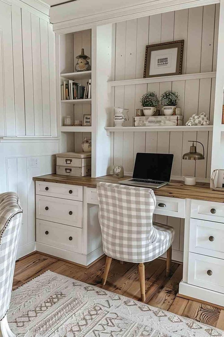 a white desk and chair in a room with wooden floors, built - in shelving