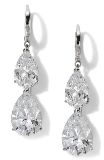 A pair of pear-shaped cubic zirconia creates an elegant aesthetic for these hand-polished earrings set in gleaming 18-karat gold plate. 1 5/8" drop; 3/8" width 18k-gold plate/cubic zirconia Imported Dazzling Diamond Cut Pear-shaped Bridal Earrings, Dazzling Pear-shaped Diamond Cut Bridal Earrings, White Gold Pear-shaped Cubic Zirconia Bridal Earrings, Pear-shaped White Gold Cubic Zirconia Bridal Earrings, Teardrop Diamond Earrings For Anniversary With Elegant Design, Pear-shaped Cubic Zirconia Diamond Earrings, Brilliant Cut Pear-shaped Cubic Zirconia Earrings, Pear-shaped Brilliant Cut Cubic Zirconia Earrings, Elegant Pear-shaped Diamond Earrings For Anniversary