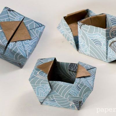 three origami boxes sitting on top of each other