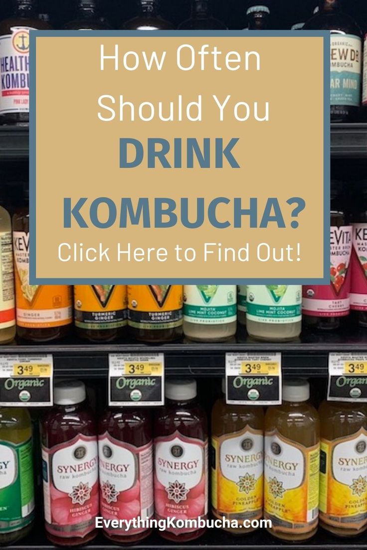 a display in a grocery store filled with drinks and condiments that says how often should you drink kombucha?