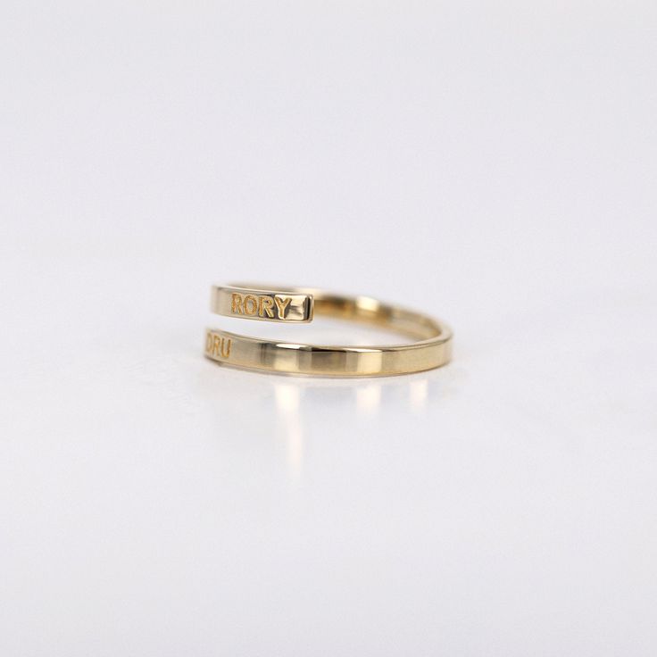 Name Ring, Initial Ring, Personalized Ring, Bypass Ring, Flat Twist Ring Band, Personalized Engraving Flat Ring, Wedding Ring, 14k Gold Ring ≫ Product Details ◈ Handmade / Handcrafted Fine Jewelry ◈ Ring Width: 2.40mm ◈ Thickness: 1.3 mm ◈ Metal: Solid 14K Gold ◈ Gold Color: White gold, Rose gold, Yellow gold ≫ Please read our FAQ below for more detail. Adjustable 14k Gold Rings For Formal Occasions, Yellow Gold Open Initial Ring For Promise, Engraved 14k Gold Bands For Promise Ring, Engraved 14k Gold Promise Ring Bands, 14k Gold Engraved Midi Rings For Wedding, Yellow Gold Promise Rings With Hallmarks, 14k Gold Open Bypass Promise Ring, Adjustable Yellow Gold Initial Ring, Adjustable 14k Gold Open Bypass Ring