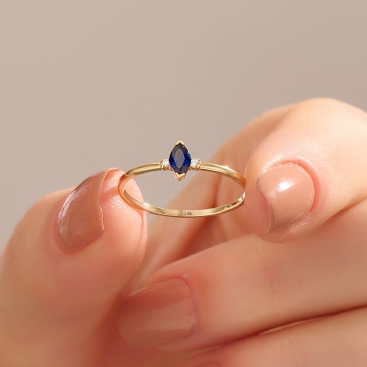 14k Solid Gold Marquise Cut Sapphire Solitaire Ring for Women. Minimalist and Dainty Design Navy Blue Gemstone Engagement Ring is available in Yellow White and Rose Gold Color Options. Tiny Blue Stone Promise Ring will enchant you with its simple but sparkling design. It will be reminiscent of the serene ocean, making it a unique gift symbolizing love and calmness. Ring Details ❥ Gold KT:  14k Solid Gold ❥ Gold Color Options; Yellow Gold, White Gold, Rose Gold ❥ Band Width: 1.02 mm ❥ Thickness: Sapphire Stackable Birthstone Ring In 14k Gold, Sapphire Marquise Ring As Gift, 14k Gold Marquise Sapphire Ring, Minimalist Birthstone Ring, Fine Jewelry 14k Gold Sapphire Birthstone Ring, 14k Gold Marquise Birthstone Ring Gift, Engagement Rings Simple, Blue Gemstone Engagement Rings, Sapphire Solitaire Ring