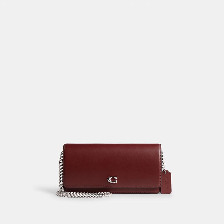 Form function and craftsmanship combine on our refined leather Evie Long Wallet. Detailed with our Signature hardware it has a convenient outside pocket and a spacious interior with multiple card slots a billfold compartment and a zip pocket for coins plus space for the largest size phone. Toss in a bag carry as a clutch or wear crossbody with the detachable gleaming chain strap. | Coach Evie Long Wallet With Chain - Women's Designer Crossbody - Silver/dark Ruby Wallet With Chain, Honey Brown, Designer Crossbody, Signature Hardware, Wallet Chain, Long Wallet, A Bag, Chain Strap, Designing Women