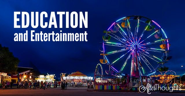 an amusement park at night with ferris wheel lit up