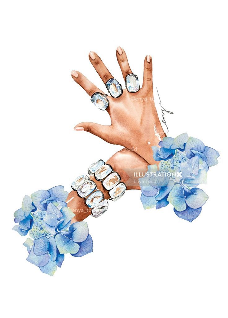 a hand with blue flowers and jewels on it