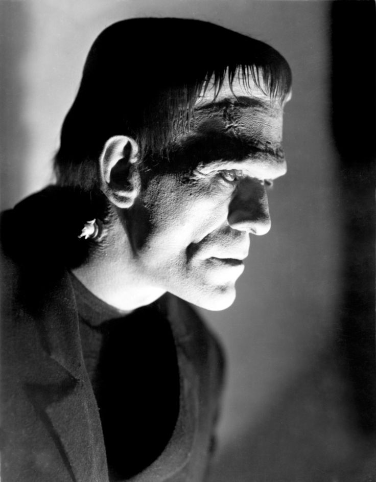 a black and white photo of a man with spooky hair