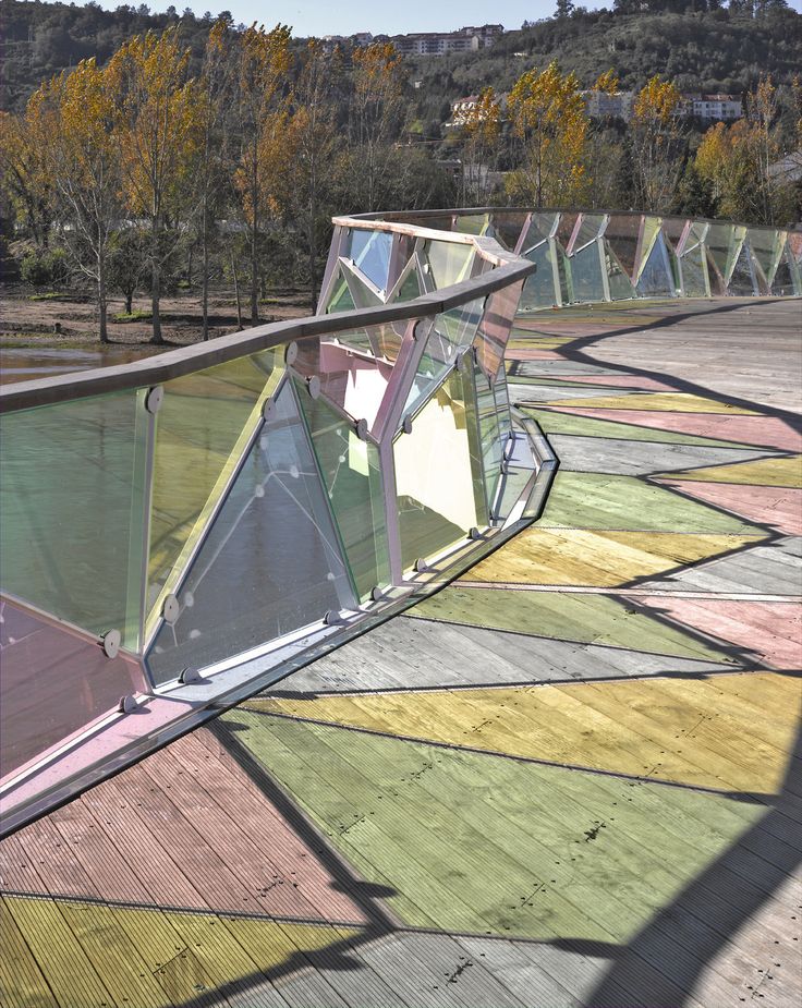 an artisticly designed glass walkway in the mountains