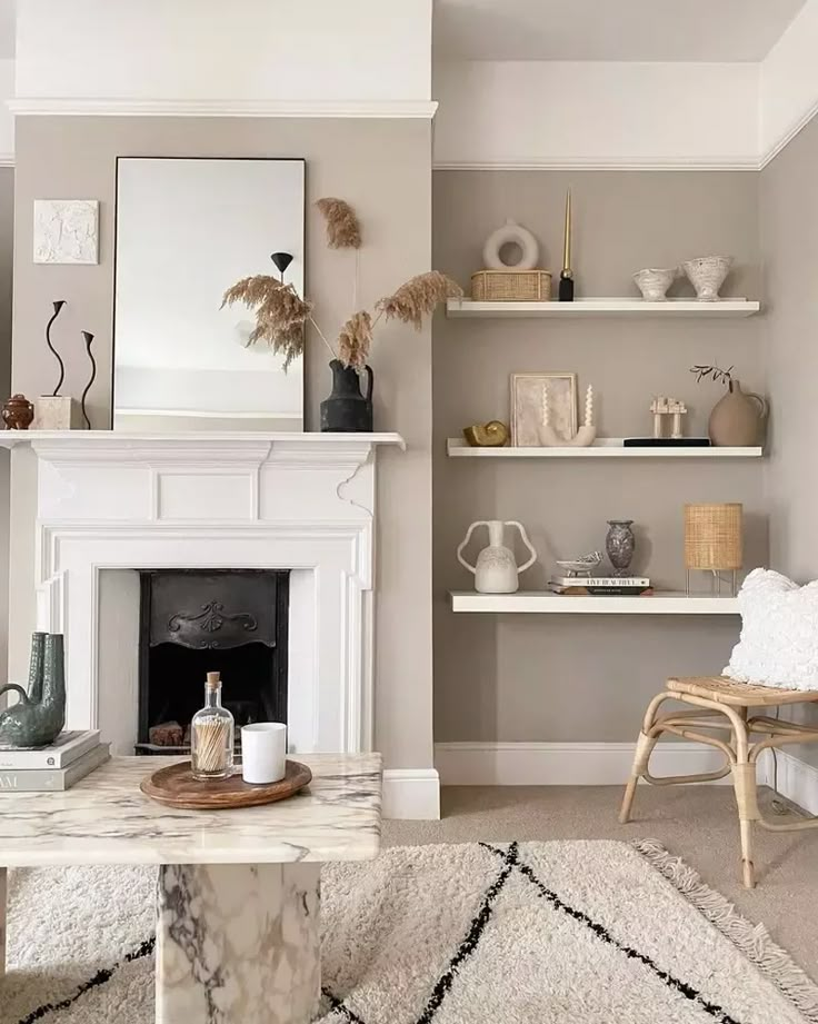 a living room filled with furniture and a fire place in the middle of a room