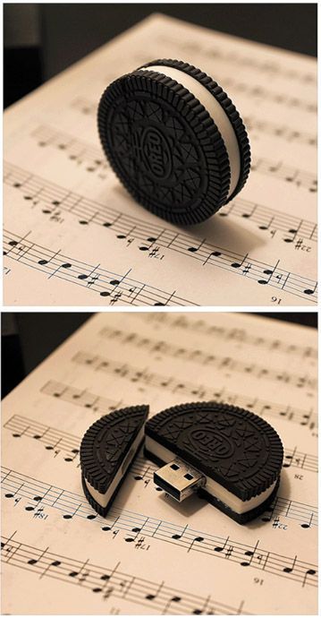 an oreo cookie is laying on top of sheet music