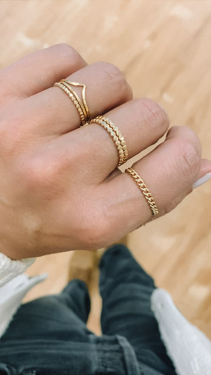 We love this chain ring worn individually for a simple adornment, or stacked for a stronger statement. 1.8mm band width. Available in 14kt Gold Fill. The larger of our two curb chains (smaller is the Stevie chain). Paired on Jess with our Confetti Ring stack, and Valley Trio.All of our jewelry is handmade to order just for you so each piece will be unique and may vary slightly from what is pictured. Due to the handmade nature of our products, items generally ship within 3-5 business days. Cheap Minimalist Chain Ring, Minimalist 14k Gold Jewelry With Thick Band, 14k Gold Thick Band Jewelry In Minimalist Style, Minimalist 14k Gold Thick Band Jewelry, Dainty Stackable Open Band, 14k Gold Dainty Curb Chain Jewelry, Stackable 14k Gold Jewelry With Thick Band, Everyday Gold Plated Open Band Ring, Dainty Double Band Stackable Jewelry