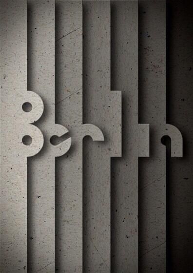 the letters are made out of concrete blocks and have been cut into smaller shapes with scissors