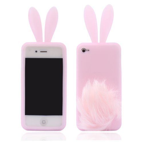 an iphone case with bunny ears and pink fur on the front, sitting next to it