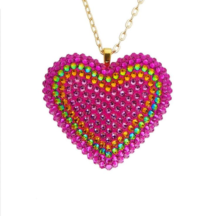 The Electric Koolade pendant embraces the trippy beauty of color-shifting crystals. Featuring over three hundred hand-placed crystals, this psychedelic combination of hot pink, rose, orange, and vitrail crystals will add a punch of color to any look. DETAILS Heart Charm: 2” wide Chain: 18” chain + 2" extender Made to order. Please allow 1-2 weeks for delivery. SIZE CHART Double Heart Beads Necklace For Party, Valentine's Day Crystal Heart Charm Necklace, Party Heart Cut Necklace With Heart Beads, Party Heart Necklace With Heart Cut Beads, Heart Beads Heart-cut Necklace For Party, Heart Pendant Necklace With Heart Beads For Party, Heart Cut Heart Beads Necklace For Party, Heart Necklace With Heart Charm For Parties, Heart-shaped Party Jewelry