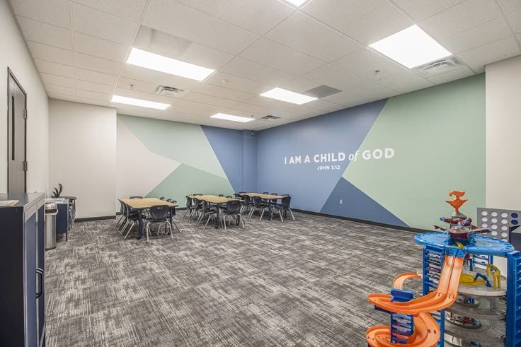 an empty room with tables and chairs in it