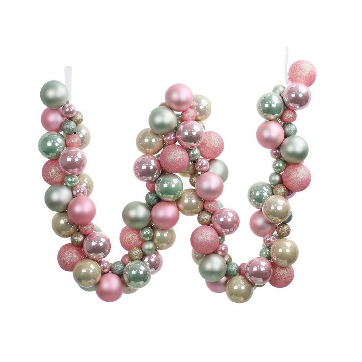 the letter m is made out of pink, green and white beads with silver balls