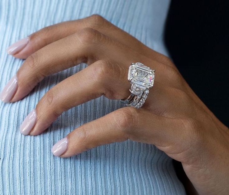 a woman's hand with a ring on it