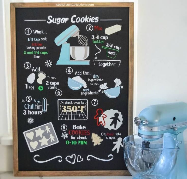 a chalkboard with instructions for how to make sugar cookies on it next to a mixer