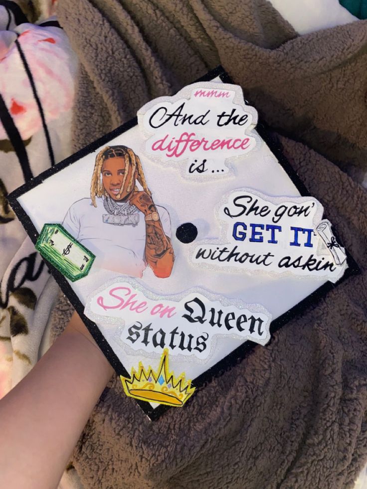 a person wearing a graduation cap that has been decorated with the words and an image of a woman's face