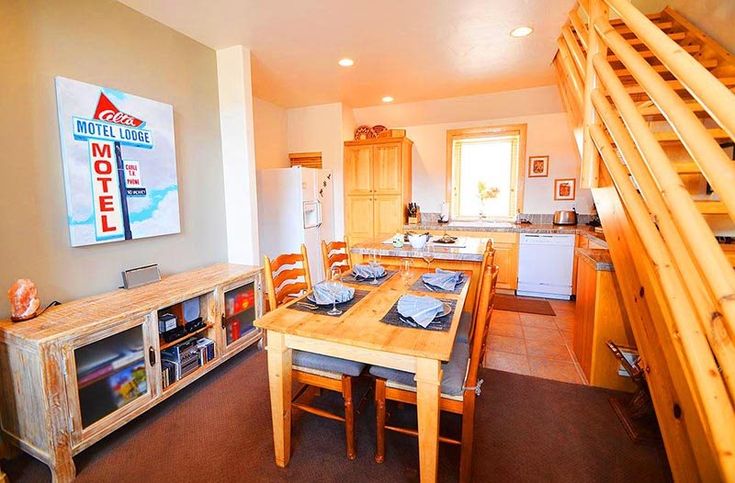 the kitchen and dining room are separated by a spiral staircase