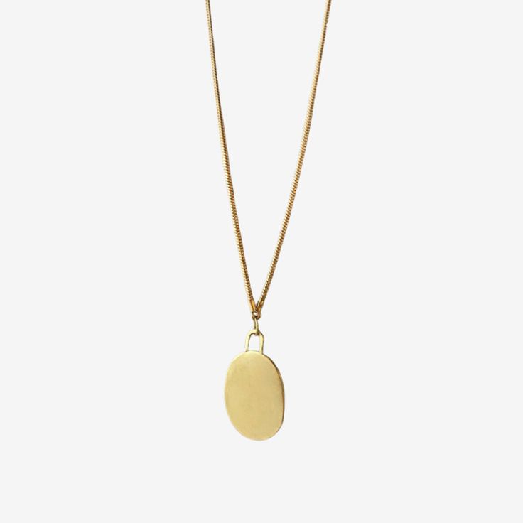 SIMPLE, TIMELESS WHAT IT IS: An organic shaped pendant necklace WHY IT’S SPECIAL: A necklace named 'pebble' in Arabic—we love this ode to the structured and natural world and it's reminder to welcome challenges and remain strong Make it extra special by engraving this pendant with up to 5 letters! Spell it out on the front or the reverse—it's the perfect personalization Handmade in St. Louis by emerging black designer Shayba Muhammad GOOD TO KNOW: Length: 17 3/8" in Gold plated brass Engraving 3 Everyday Teardrop Brass Necklace, Everyday Brass Teardrop Necklace, Minimalist Brass Necklace With Oval Pendant, Modern Oval Pendant Necklace For Everyday, Everyday Locket Pendant Charm Necklace, Minimalist Everyday Medallion Necklace, Minimalist Necklace With Large Round Pendant, Everyday Oval Locket Necklaces, Oval Locket Necklace For Everyday