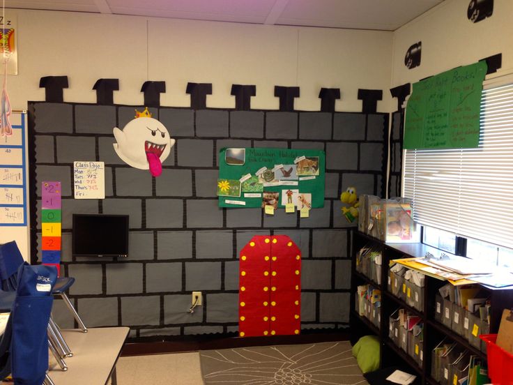 a room that has a wall made out of bricks and paper decorations on the walls