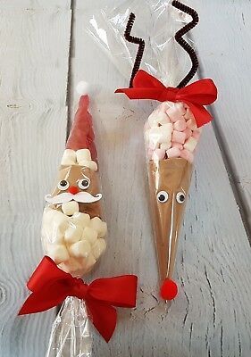 two candy cones with faces and noses on them