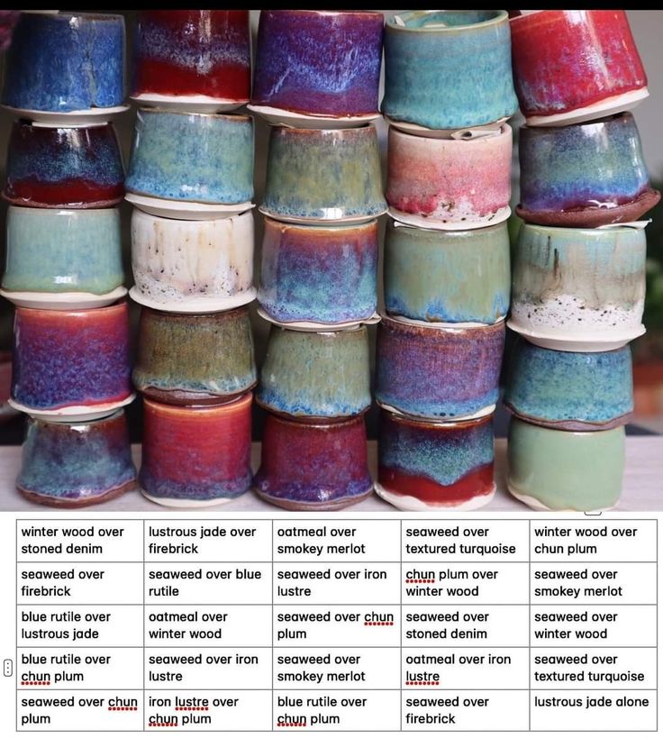 there are many different colored cups stacked on top of each other