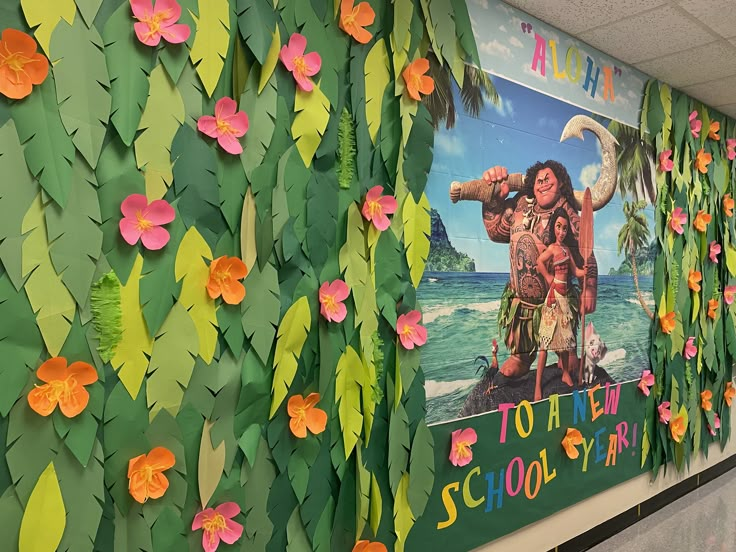 a classroom wall decorated with paper flowers and hula girl on the poster for moan's school year