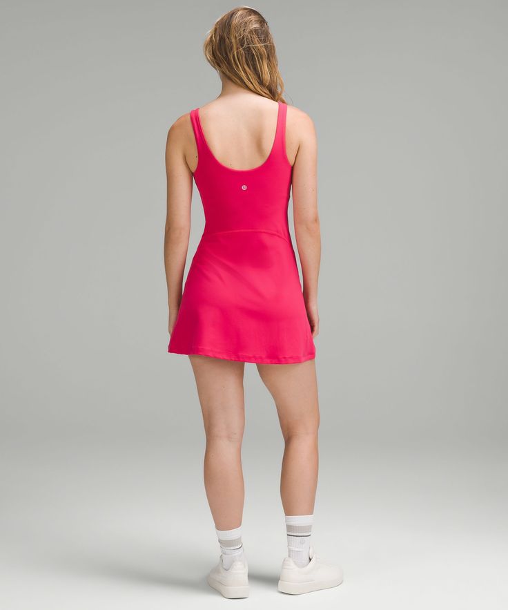 Get the buttery softness of lululemon Align in a dress. Powered by Nulu fabric and made with a built-in shorts liner, your poses and postures have never felt this free. Designed for Yoga and Casual. Sizes 0-14 fit B/C cups:Sizes 16-20 fit D/DD cups:Tight fit contours your body:Intended to sit at mid-thigh:Intended for low-impact activities. Shorts liner has side drop-in pockets and an open-back waistband to make bathroom breaks a breeze. Built-in shelf bra for added support and coverage. Pockets for optional, removable cups. Casual Workout Dresses With Built-in Bra, Fitted Lululemon Activewear For Summer, Align Dress, Cherry Dress, Lululemon Align, 80 Dress, Lululemon Women, Shelf Bra, Women Dresses