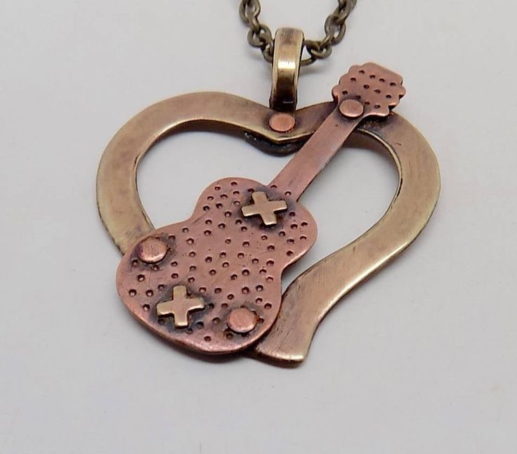 "Cool steampunk pendant . The size is 1 1/4\" by 1 1/2\" and it has 24\" antique brass chain. All my jewelry come in a nice gift box." Punk Style Nickel-free Necklace For Gifting, Collectible Bronze Metal Necklace, Music-themed Metal Jewelry For Gifts, Punk Heart Pendant Necklace As Gift, Punk Heart Pendant Necklace For Gift, Punk Style Heart Pendant Necklace For Gift, Nickel-free Metal Music-themed Jewelry, Nickel-free Music-themed Metal Jewelry, Antique Finish Retro Jewelry As Gift