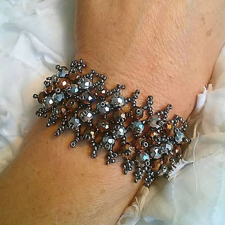 Exquisite French Look Beaded Bracelet Hand Strung High Quality One Size Fits Most...Up To 7.5" Wrist Inventory Item (#Bronze & Dark Silver)75 Crystal Beaded Bracelets With Silver Beads For Party, Silver Sparkling Beaded Bracelets For Party, Sparkling Silver Beaded Bracelets For Party, Party Crystal Beaded Bracelets With Silver Beads, Elegant Silver Crystal Stretch Bracelet, Silver Sparkling Crystal Bracelet With Round Beads, Silver Crystal Bracelet With Sparkling Round Beads, Sparkling Silver Crystal Bracelet With Round Beads, Elegant Beaded Metal Stretch Bracelet