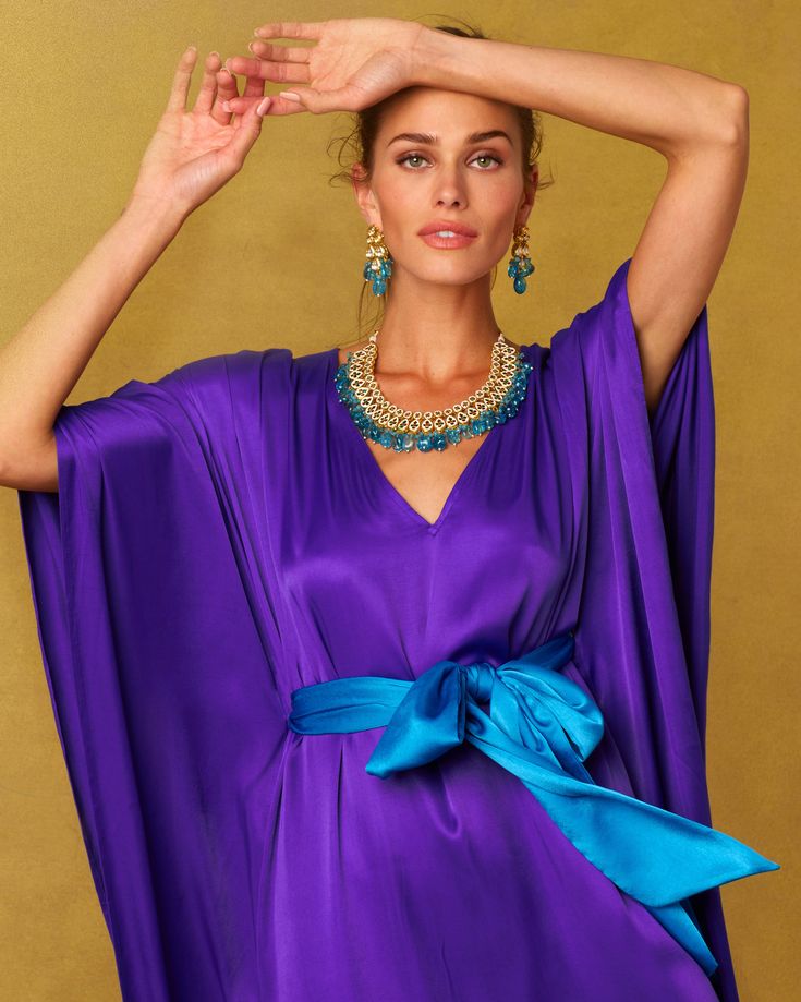 We've now re-imagined our best selling purple belted kaftan in abeautifully draping silk that is both soft and luxurious. A most sumptuous yet restrained statement sure to wow at any black tie event. The rich purple of the Alessandra Belted Kaftan is a true royal purple—the one with deep blue undertones perfected by the Phoenicians millennia ago. It was a dye so rare and precious that only royalty could wear it, from Cyrus the Great of Persian to Roman Emperors to rulers of the Byzantium. Today, Royal Blue Belt, Blue Sash, Cyrus The Great, Short Kaftan, Casual Luxe, Silk Kaftan, Black Tie Event, Silk Slip, Abayas Fashion