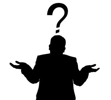 a man is standing with his hands in the air and a question mark above his head