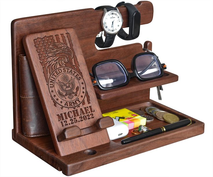 a wooden case with sunglasses and other items in it