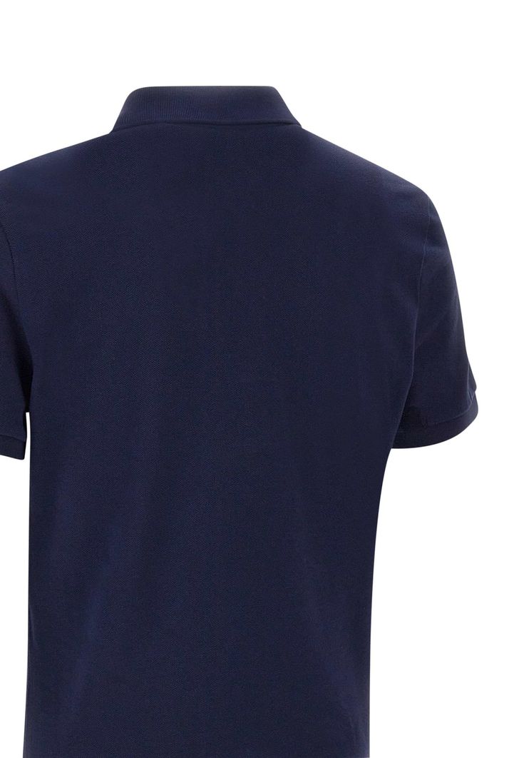 Lacoste men's cotton polo shirt, navy blue, classic collar, two-button fastening, short sleeves, ribbed hems, side slits on hem, iconic logo on chest, slim fit. Composition: 100% Cotton Navy Short Sleeve Polo Shirt With Ribbed Collar, Navy Cotton Polo Shirt For Work, Navy Cotton Polo Shirt With Ribbed Collar, Navy Fitted Cotton Polo Shirt, Navy Fitted Polo Shirt, Navy Short Sleeve Polo Shirt For Work, Slim Fit Collared Cotton Polo Shirt, Slim Fit Cotton Collared Polo Shirt, Solid Cotton Slim Fit Polo Shirt